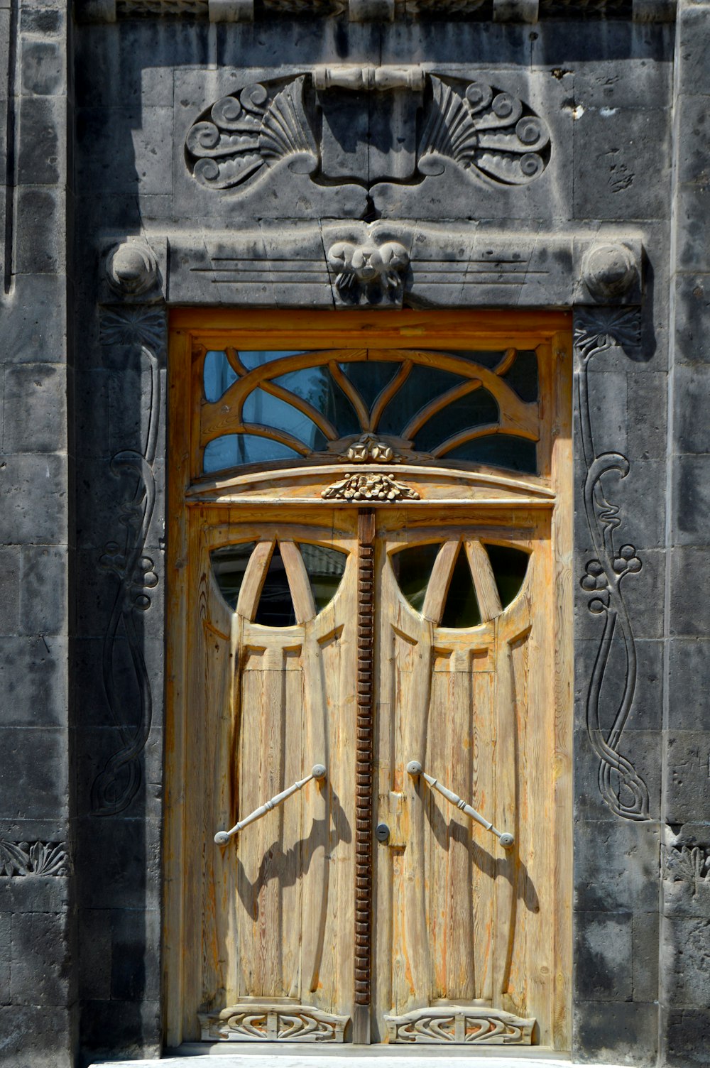 brown wooden door with cross