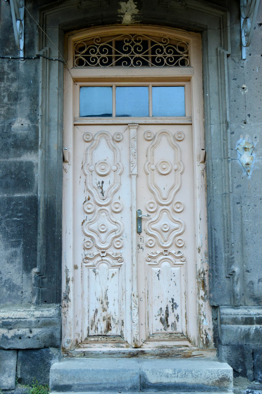 blue wooden door with white steel door