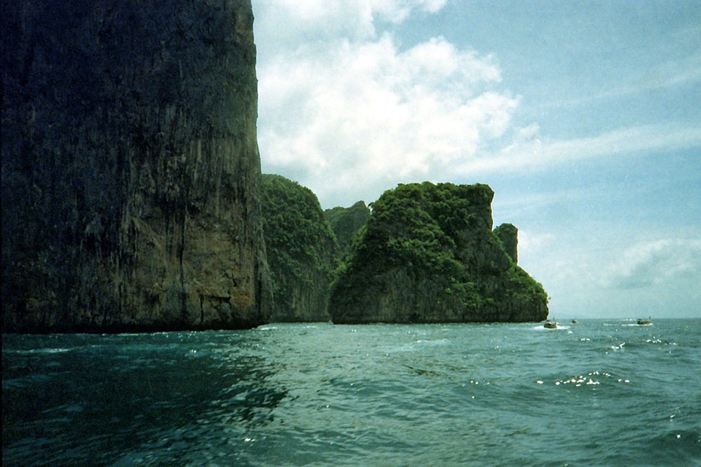 brown rock formation on sea during daytime