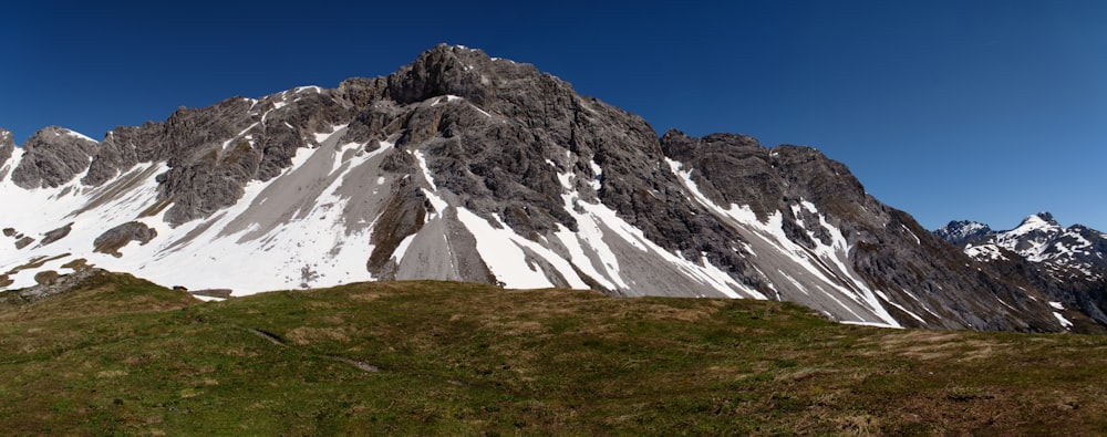 snow covered mountain under blue sky during daytime