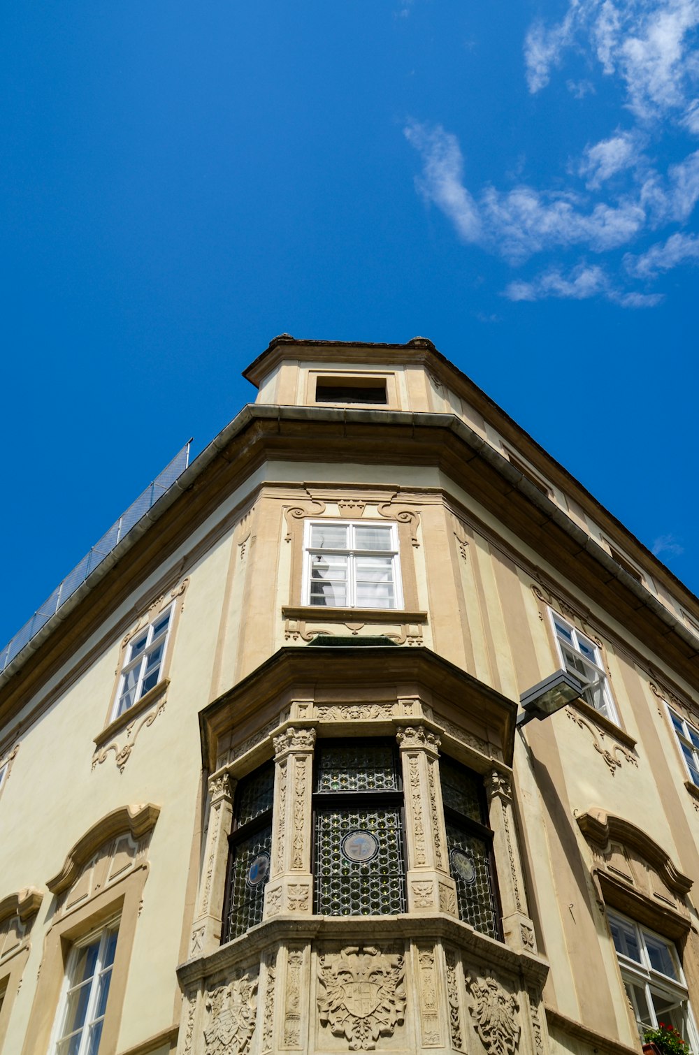 beige concrete building under blue sky during daytime