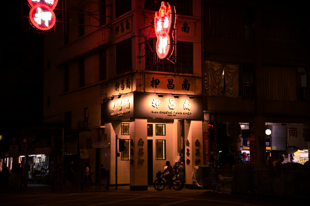 people walking on street during nighttime