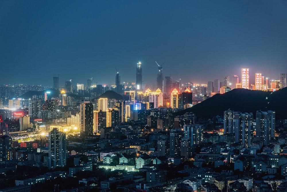 city with high rise buildings during night time