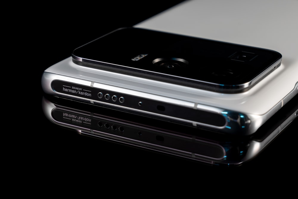 black iphone 4 on silver stereo component