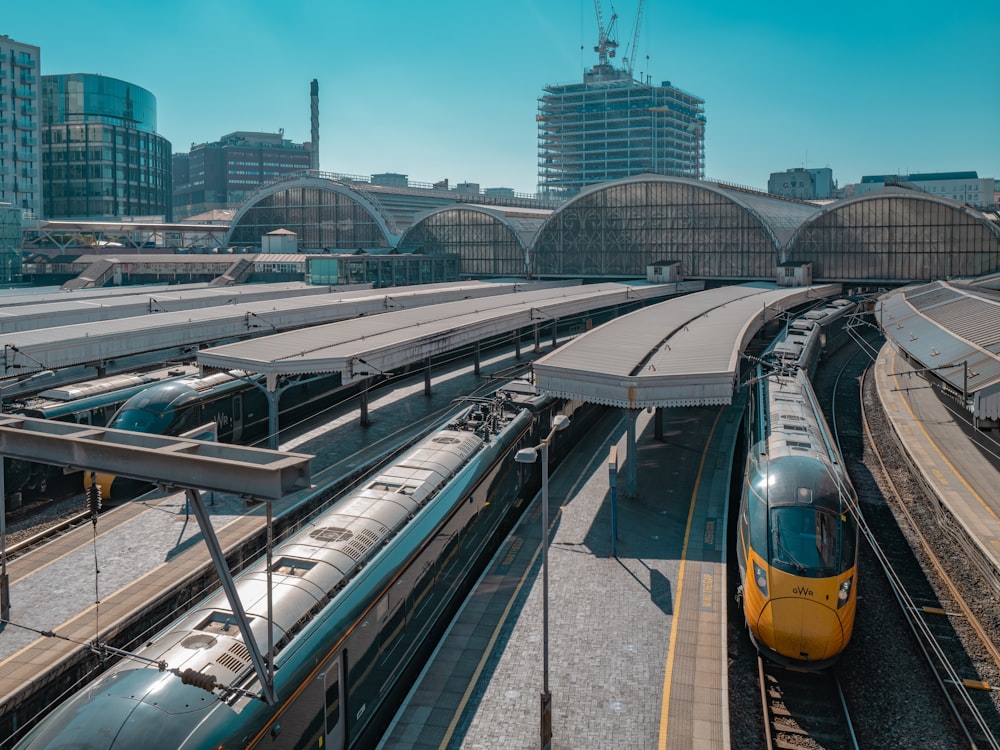 yellow and black train on rail during daytime