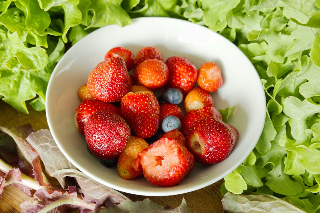 strawberries on white ceramic bowl