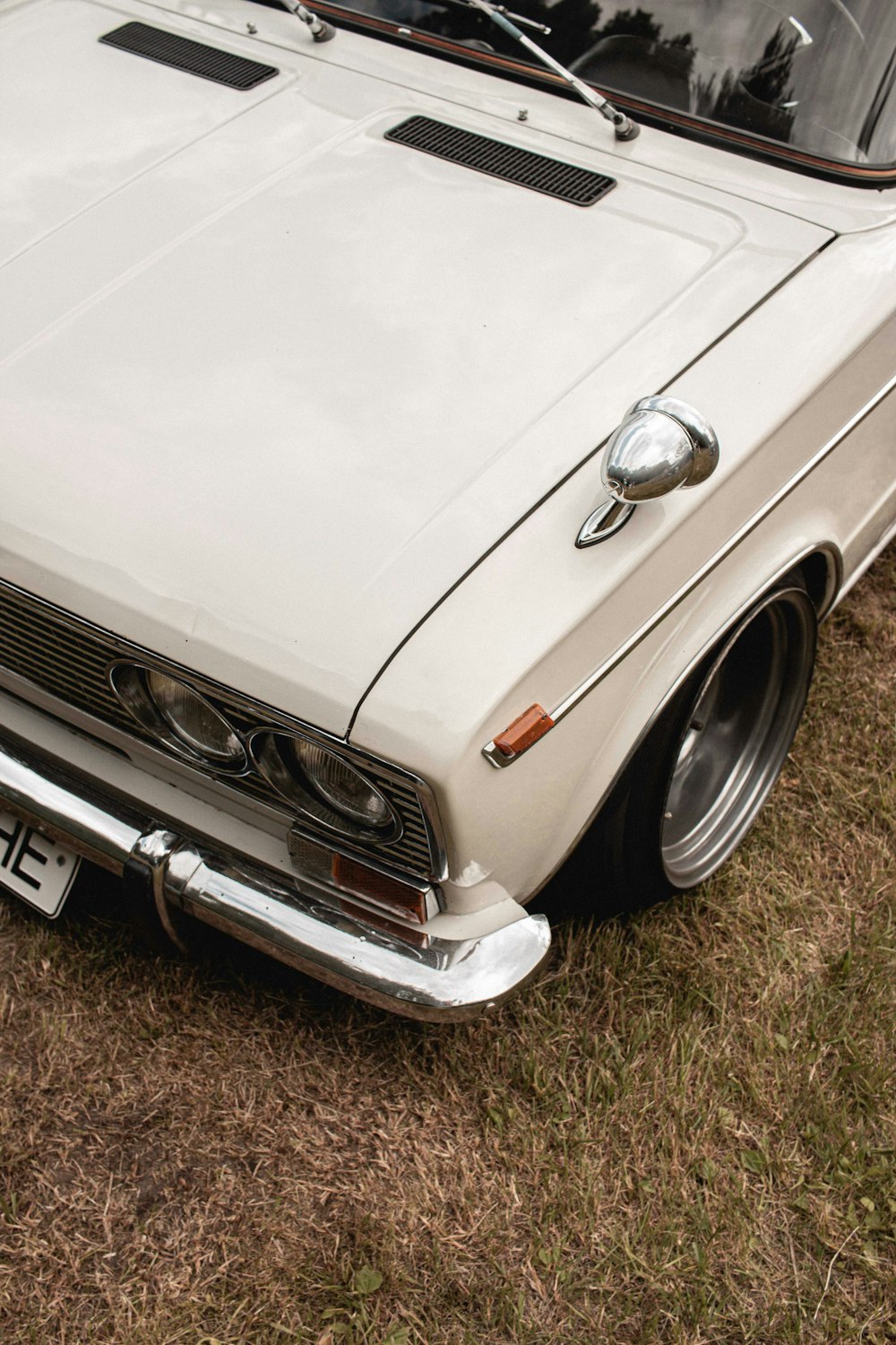 white mercedes benz car on brown soil