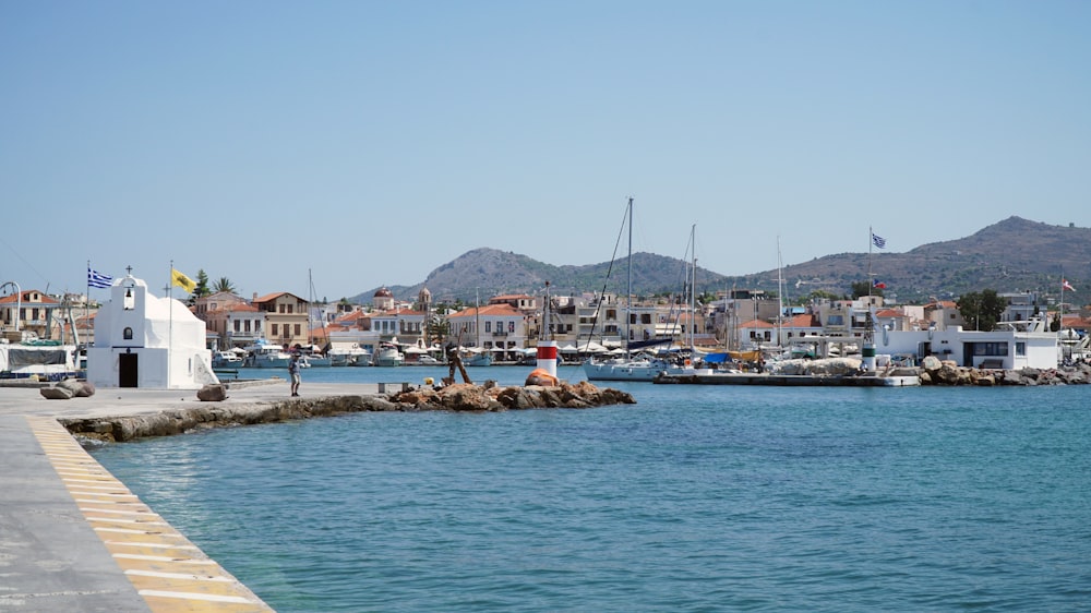 white and blue boat on sea during daytime