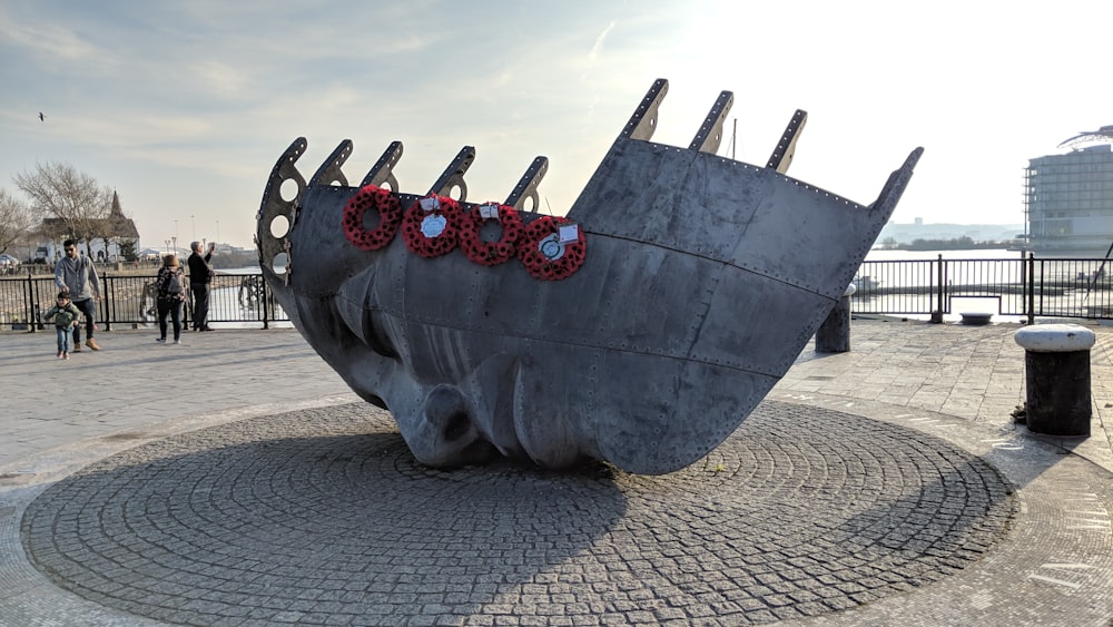 black and red ship on gray sand during daytime