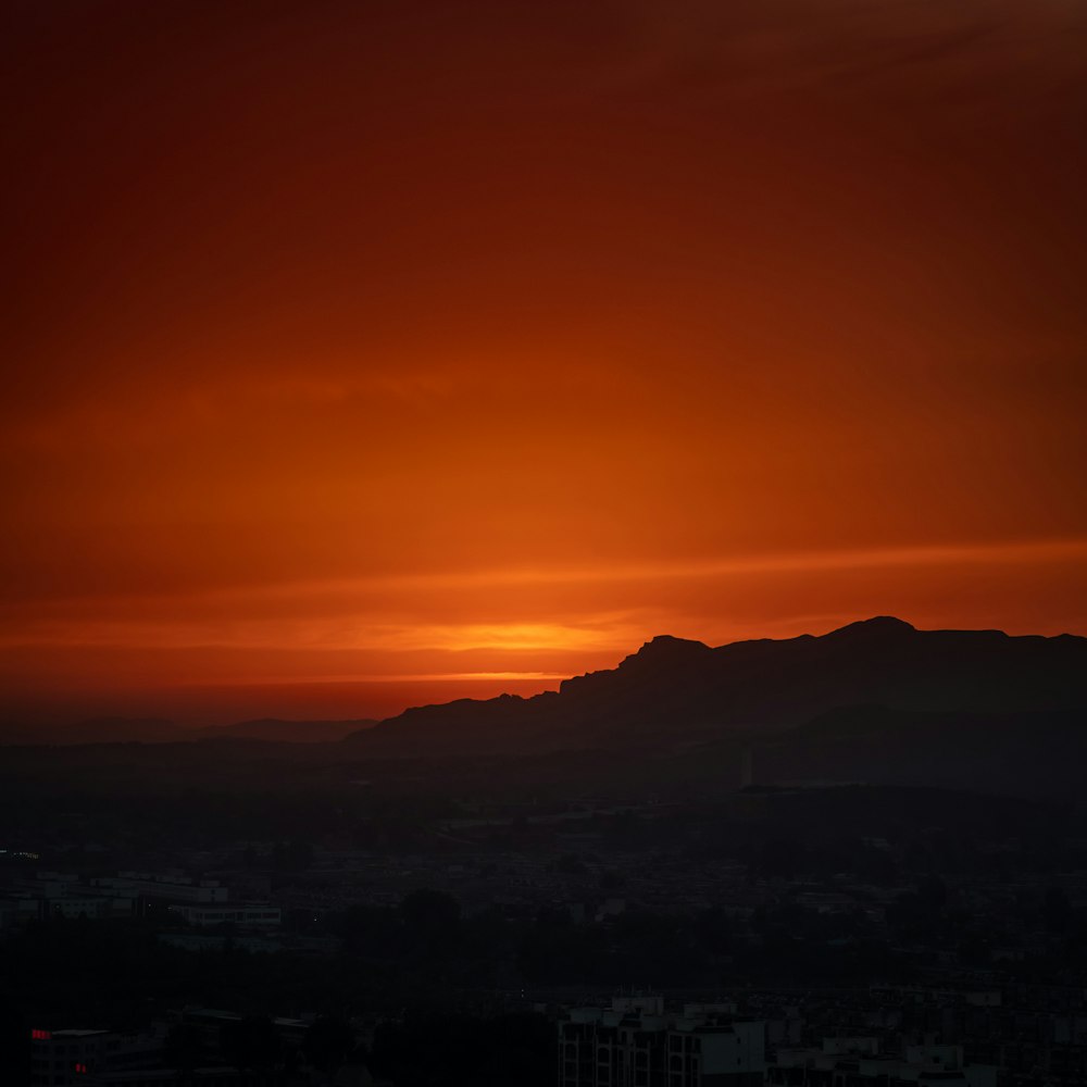 silhouette of mountains during sunset