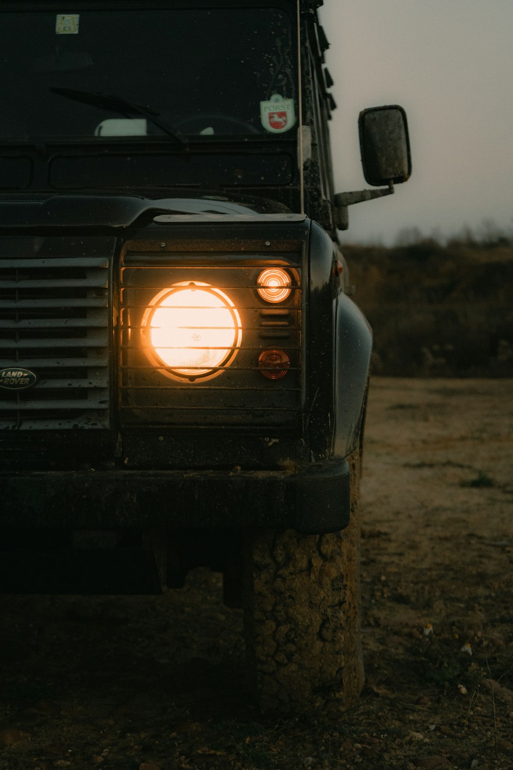 black car on brown soil