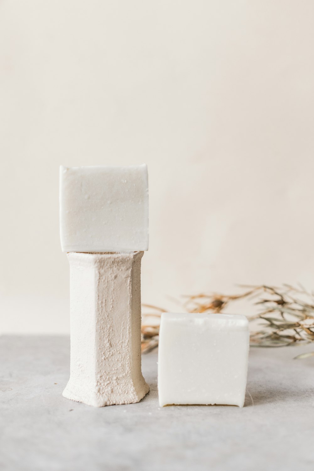 white concrete cross on gray sand