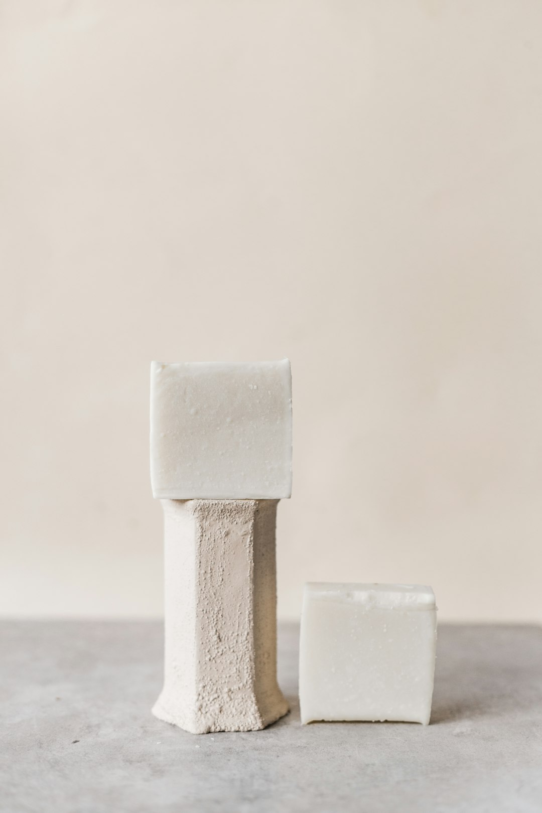 white wooden cross on gray sand