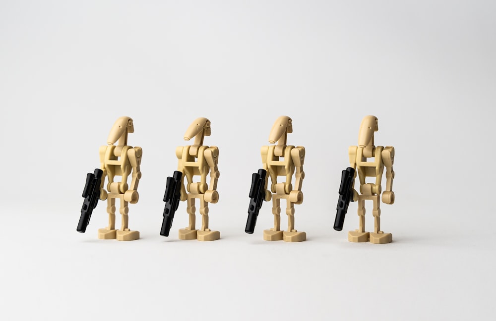 four lego driods from the star wars series.