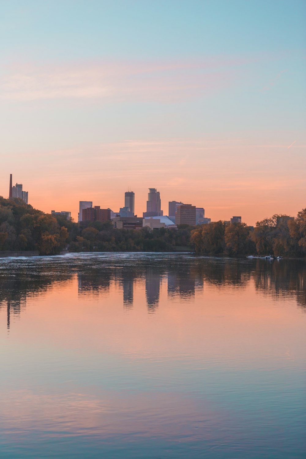 a body of water with a city in the background