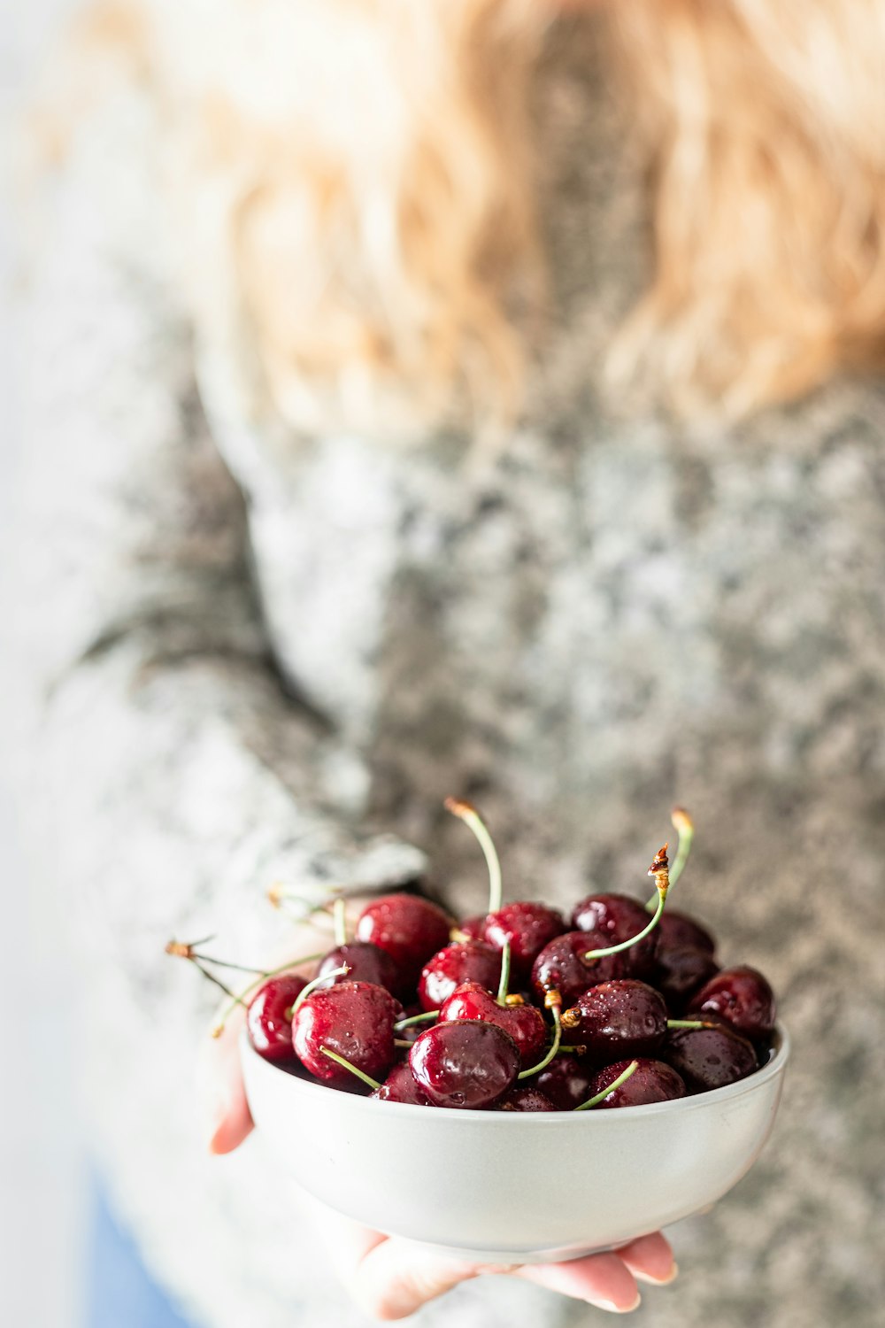 red round fruits on white surface