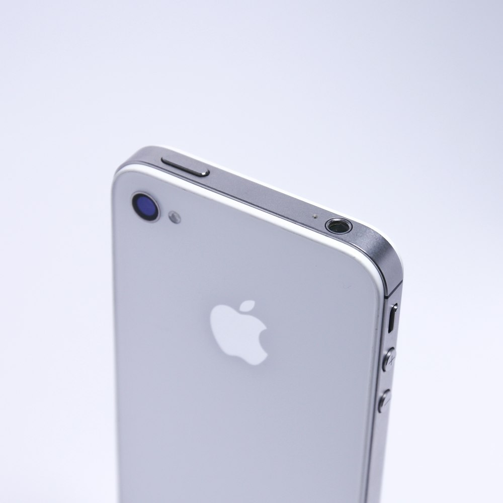 silver iphone 6 on white surface
