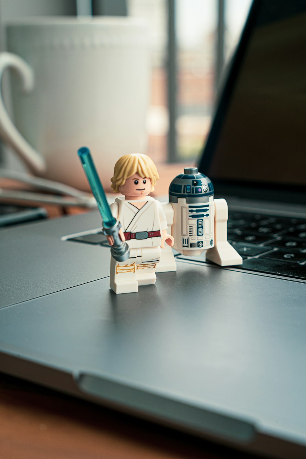 lego mini figure beside white and blue plastic bottle