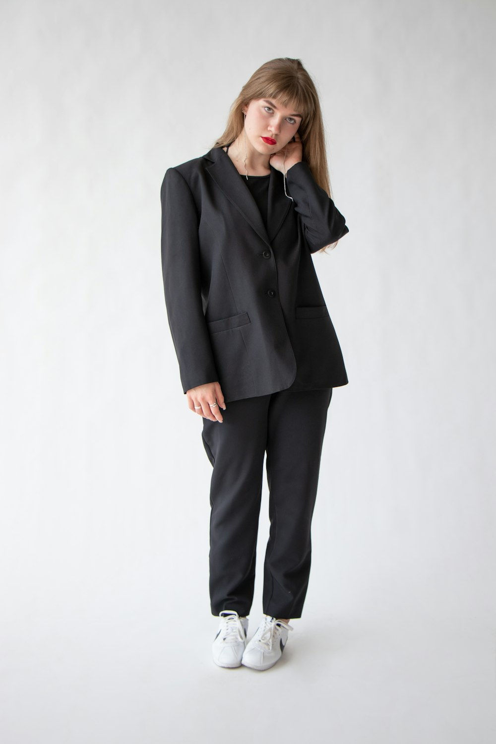 woman in black blazer and black pants