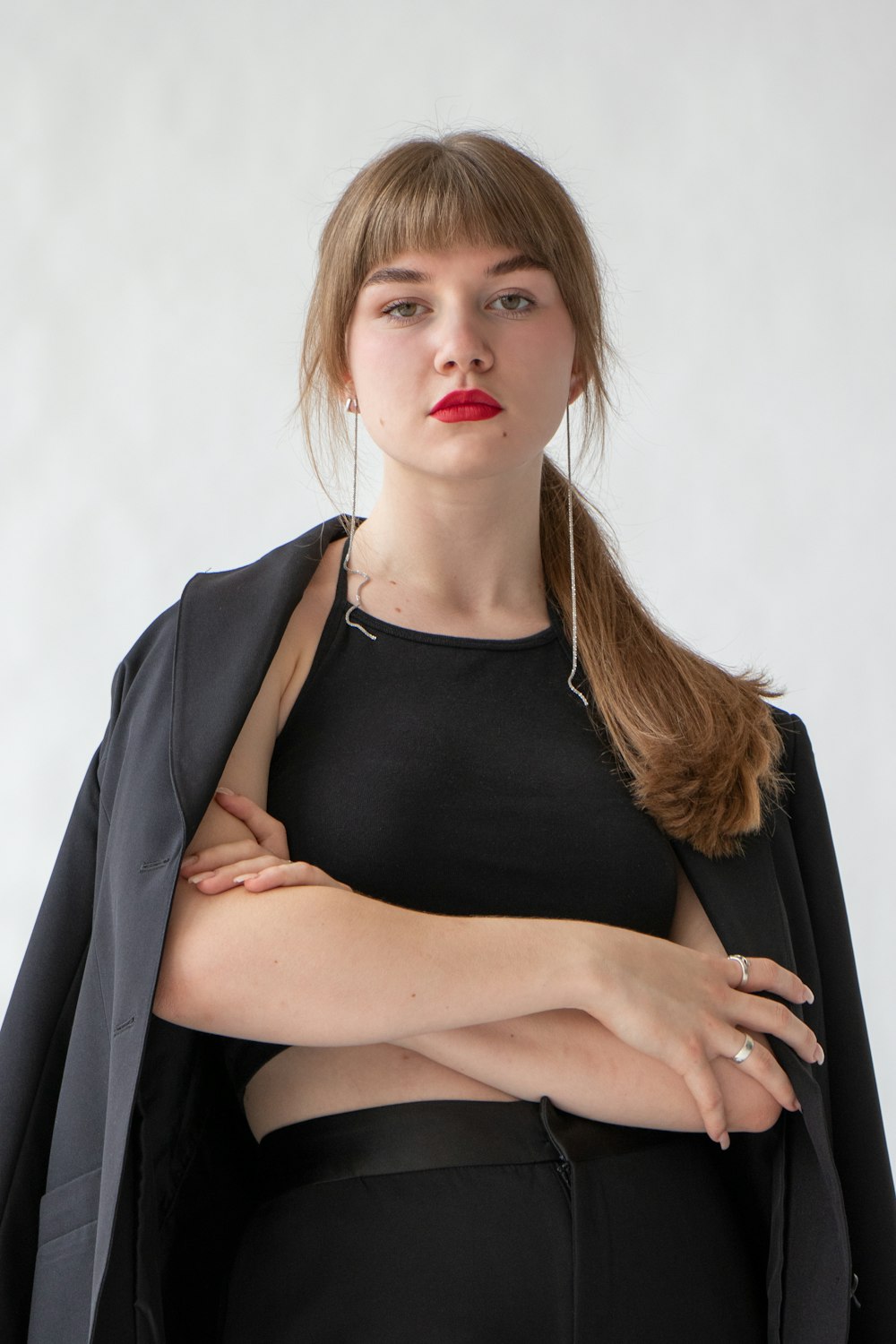 woman in black tank top and black blazer