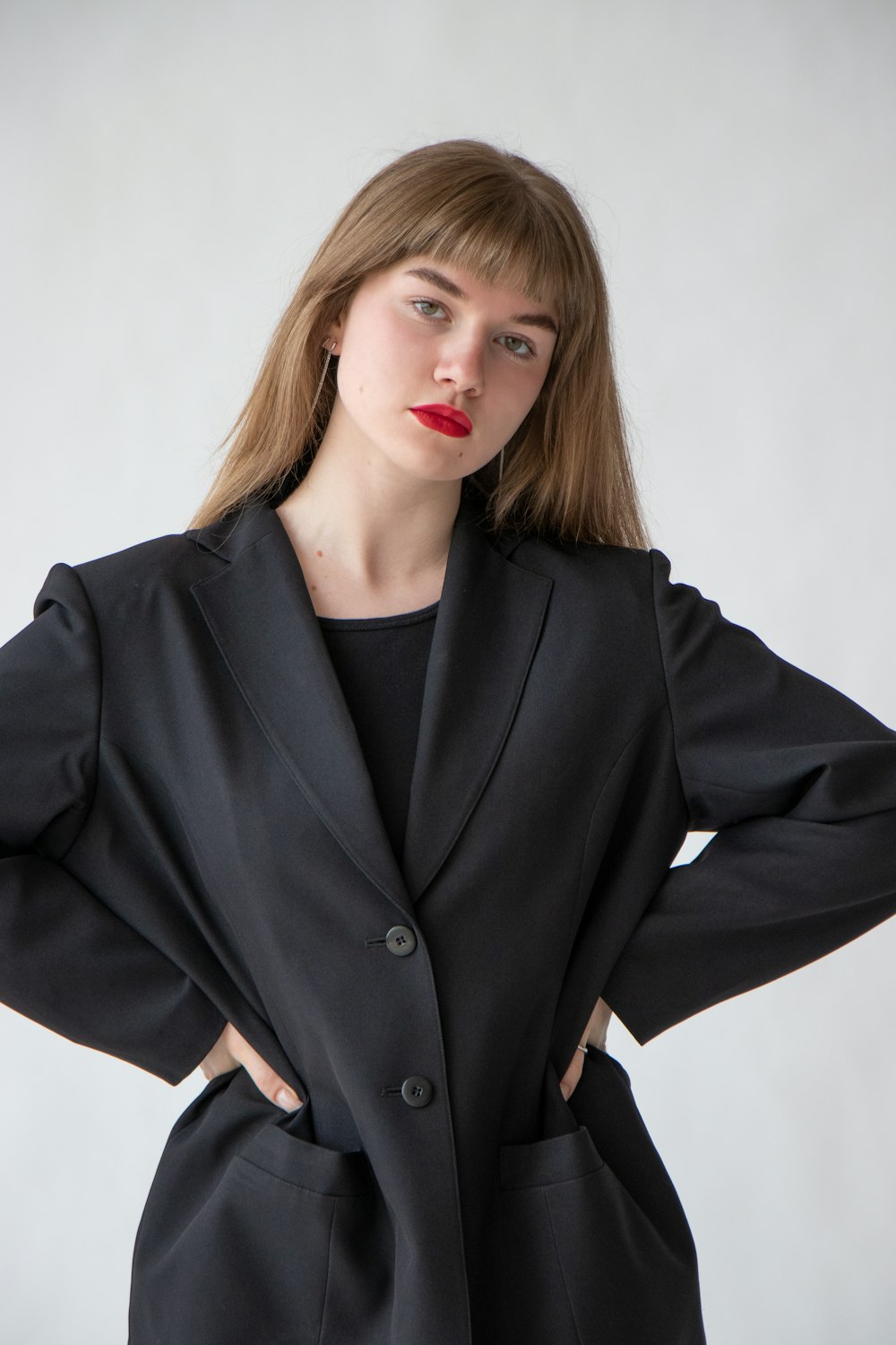 woman in black blazer standing