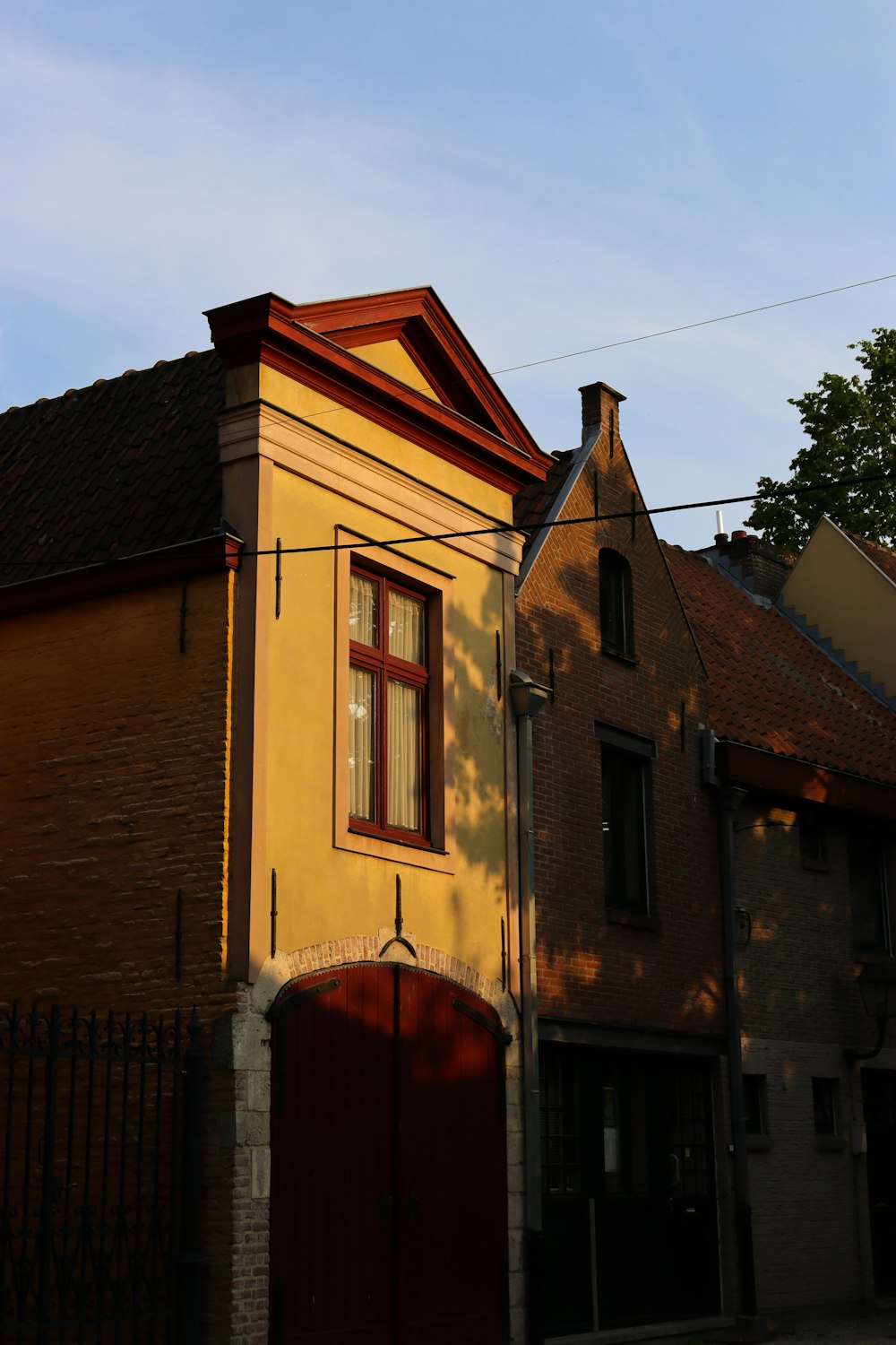 brown brick building under blue sky during daytime