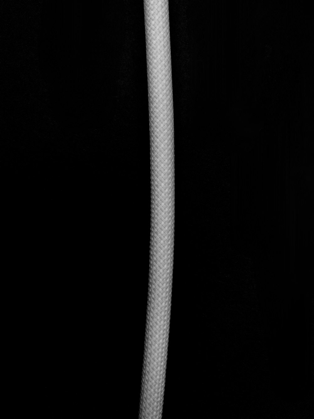 white rope on black background