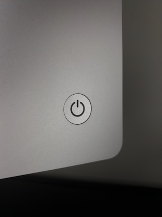 A sleek digital illustration of a glowing power button integrated with the Indian map outline.