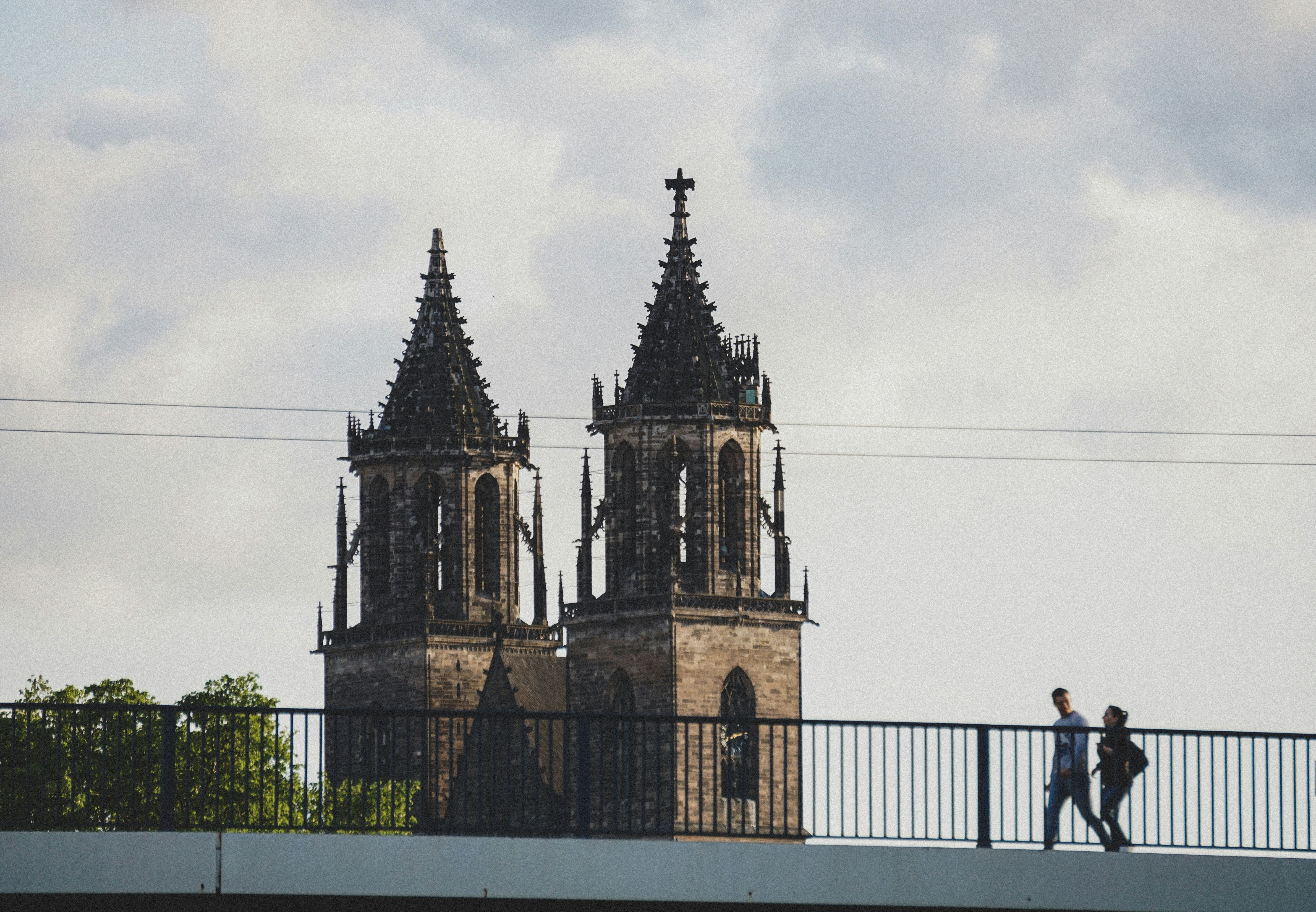 people walking on sidewalk near cathedral