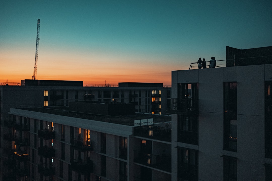 black and white concrete building during sunset