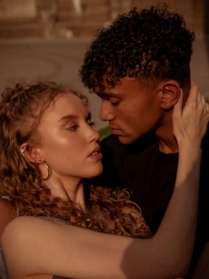 A close-up of two people engaged in a heartfelt conversation, eyes locked in understanding.