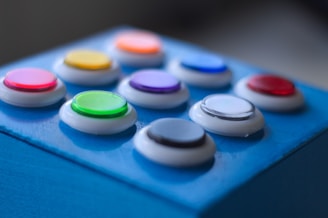 blue white green yellow and red buttons