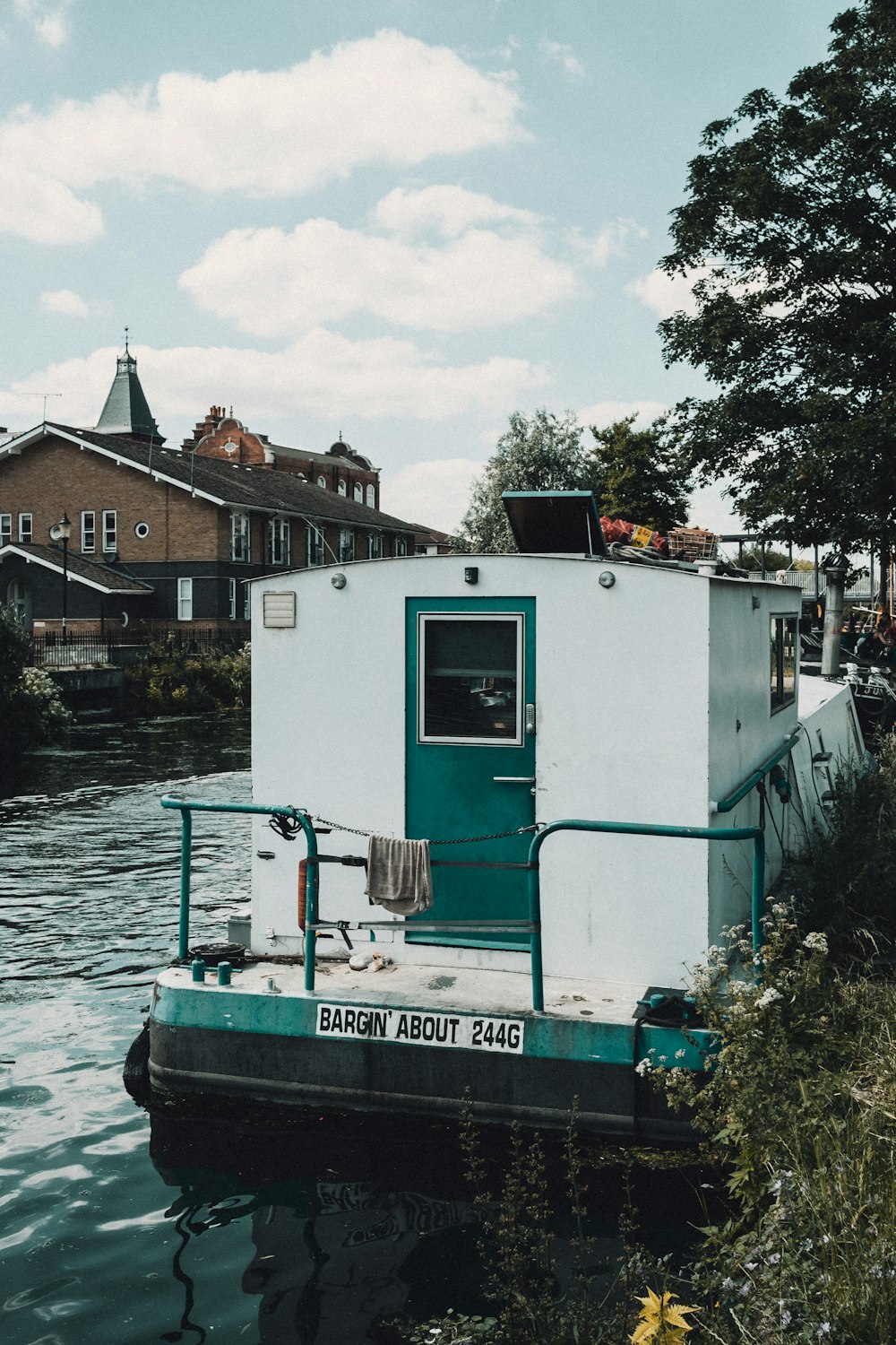 green and white boat on water