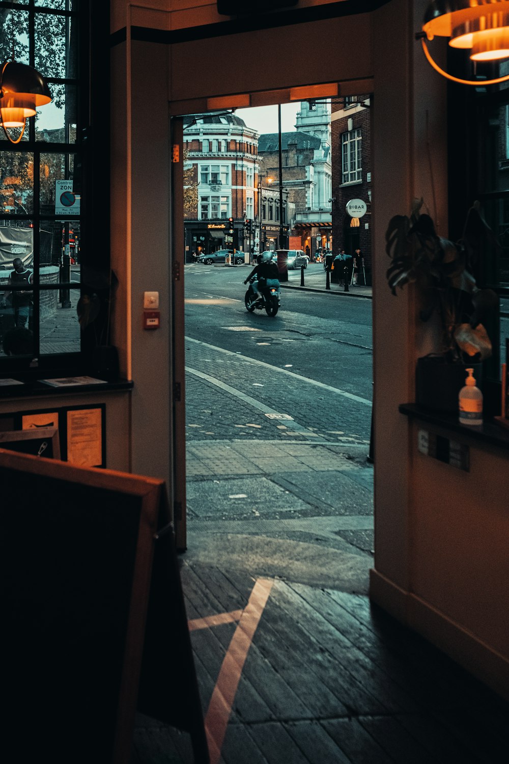 black motorcycle parked beside brown wooden table