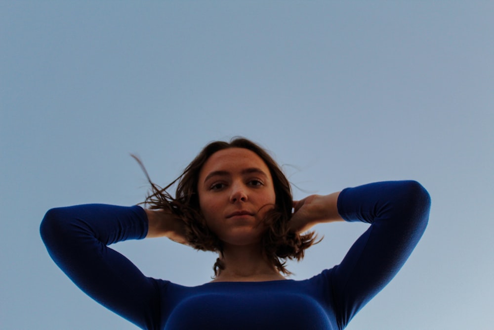 woman in blue long sleeve shirt