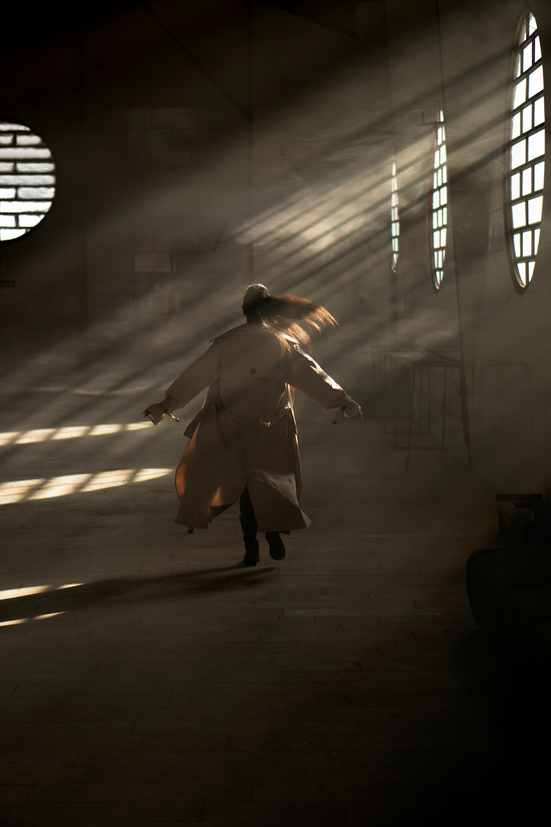 man in white coat walking on tunnel