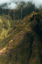 Lush green mountains and waterfalls in a vibrant South American landscape