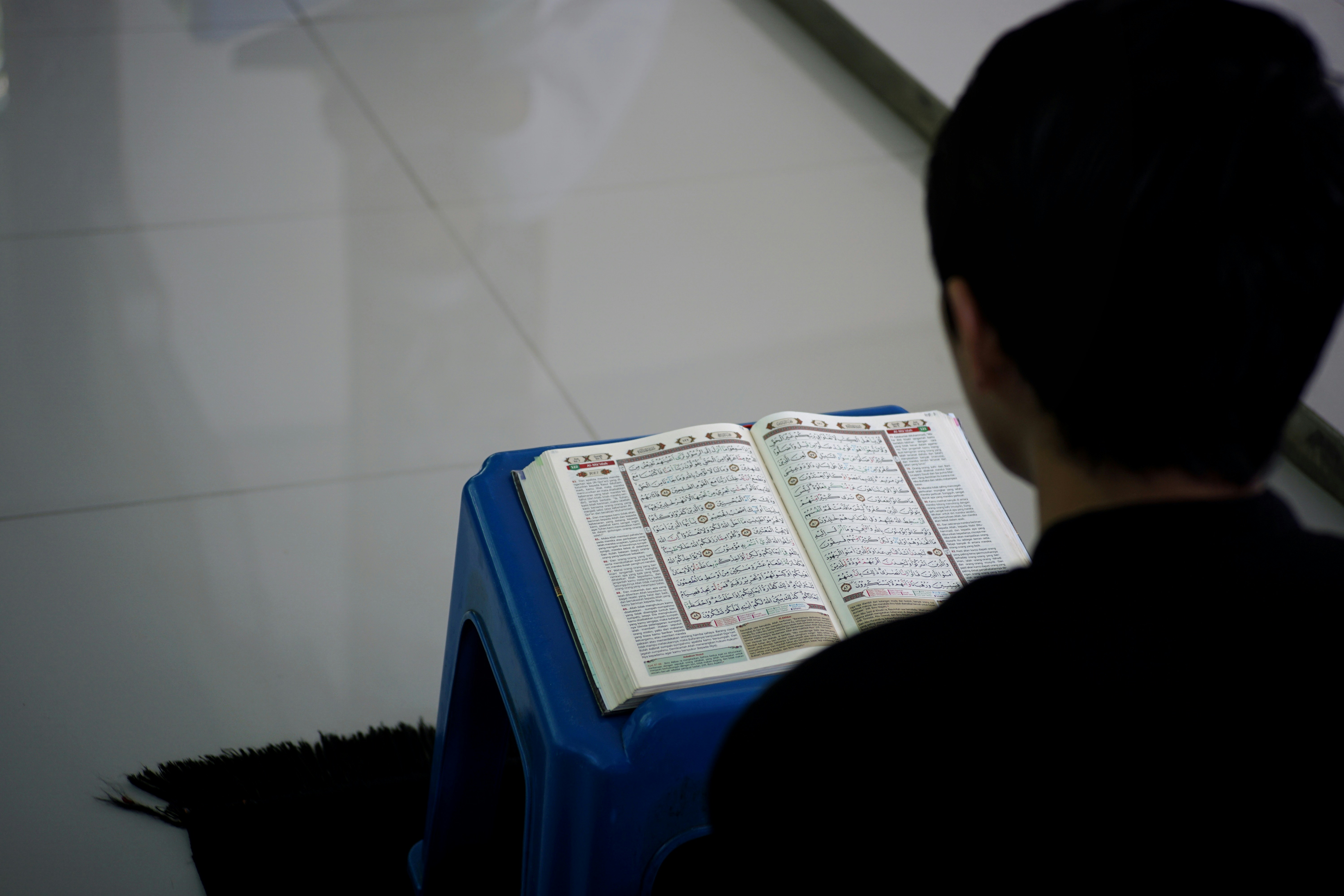 A man reading and memorizing quran