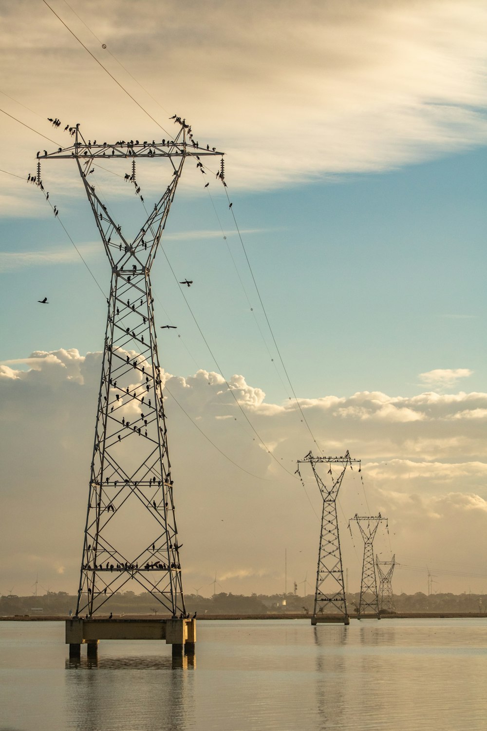 black electric tower under blue sky