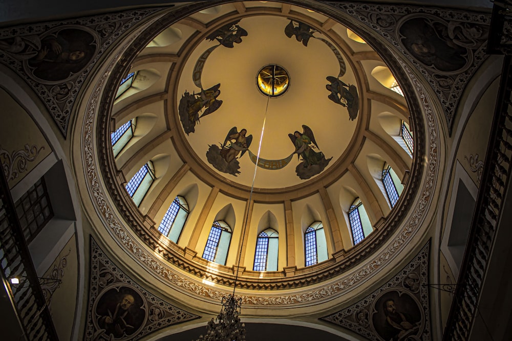 low angle photography of brown and white dome ceiling