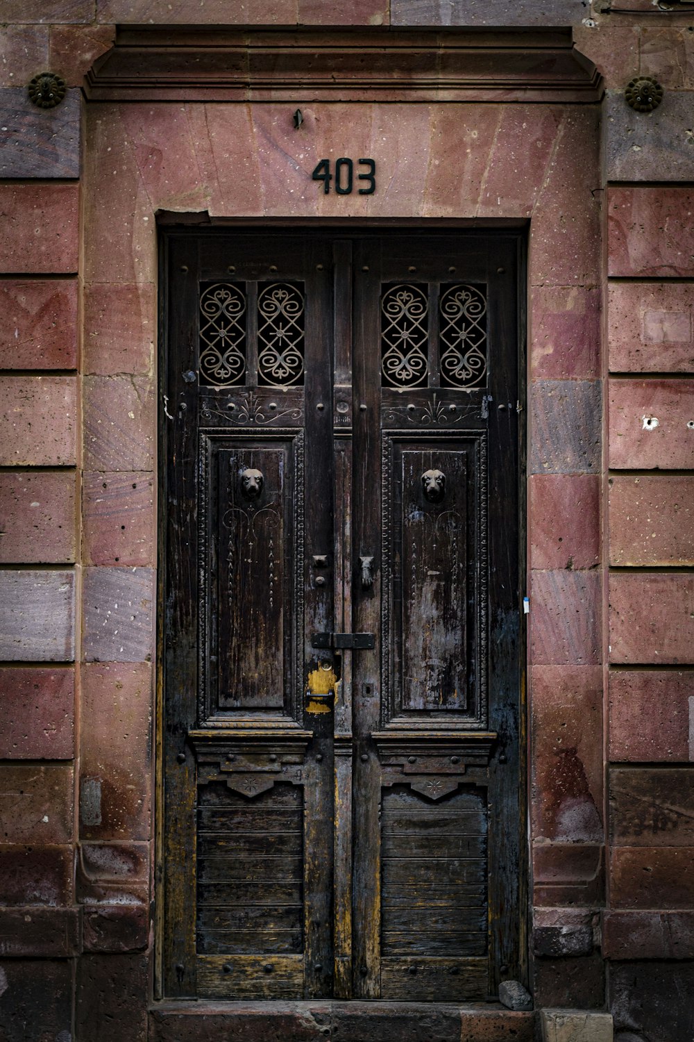 a couple of doors that are in front of a building