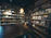 Cozy tobacco shop interior with neatly arranged shelves and warm lighting.