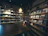Cozy tobacco shop interior with neatly arranged shelves and warm lighting.