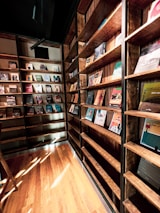 A peaceful library corner with sunlight streaming over shelves of religious texts.
