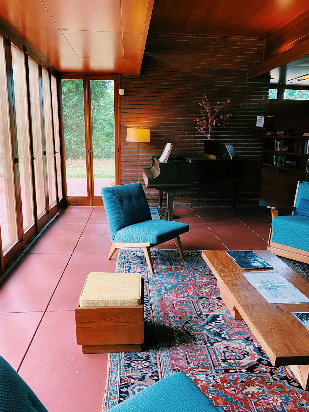 blue and brown chair beside brown wooden table