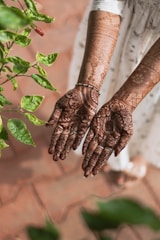 brown and black hand tattoo