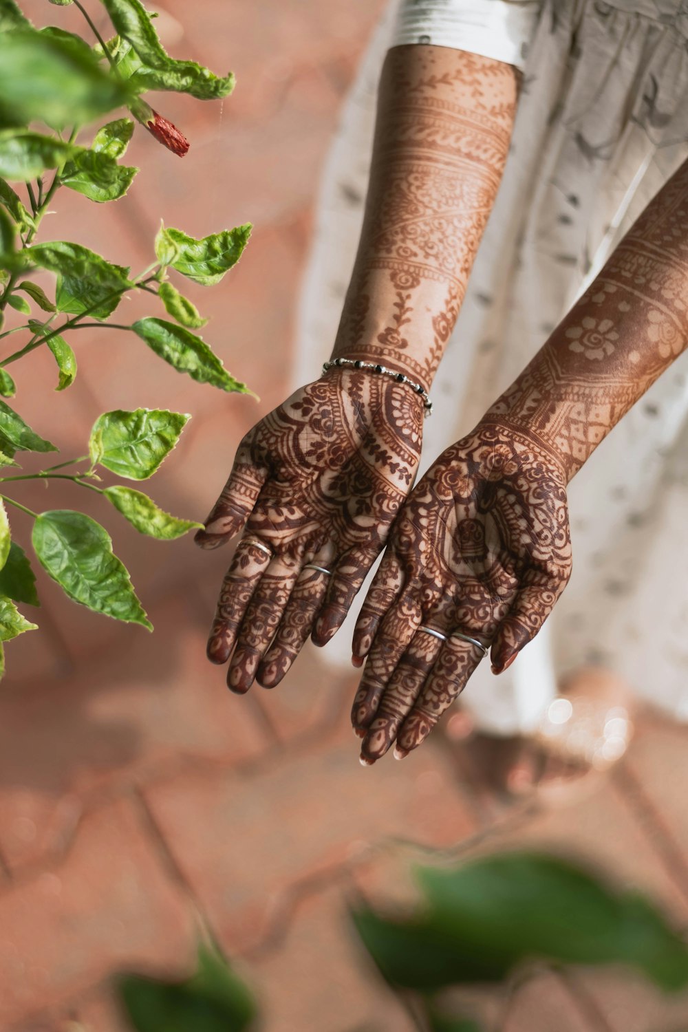 brown and black hand tattoo