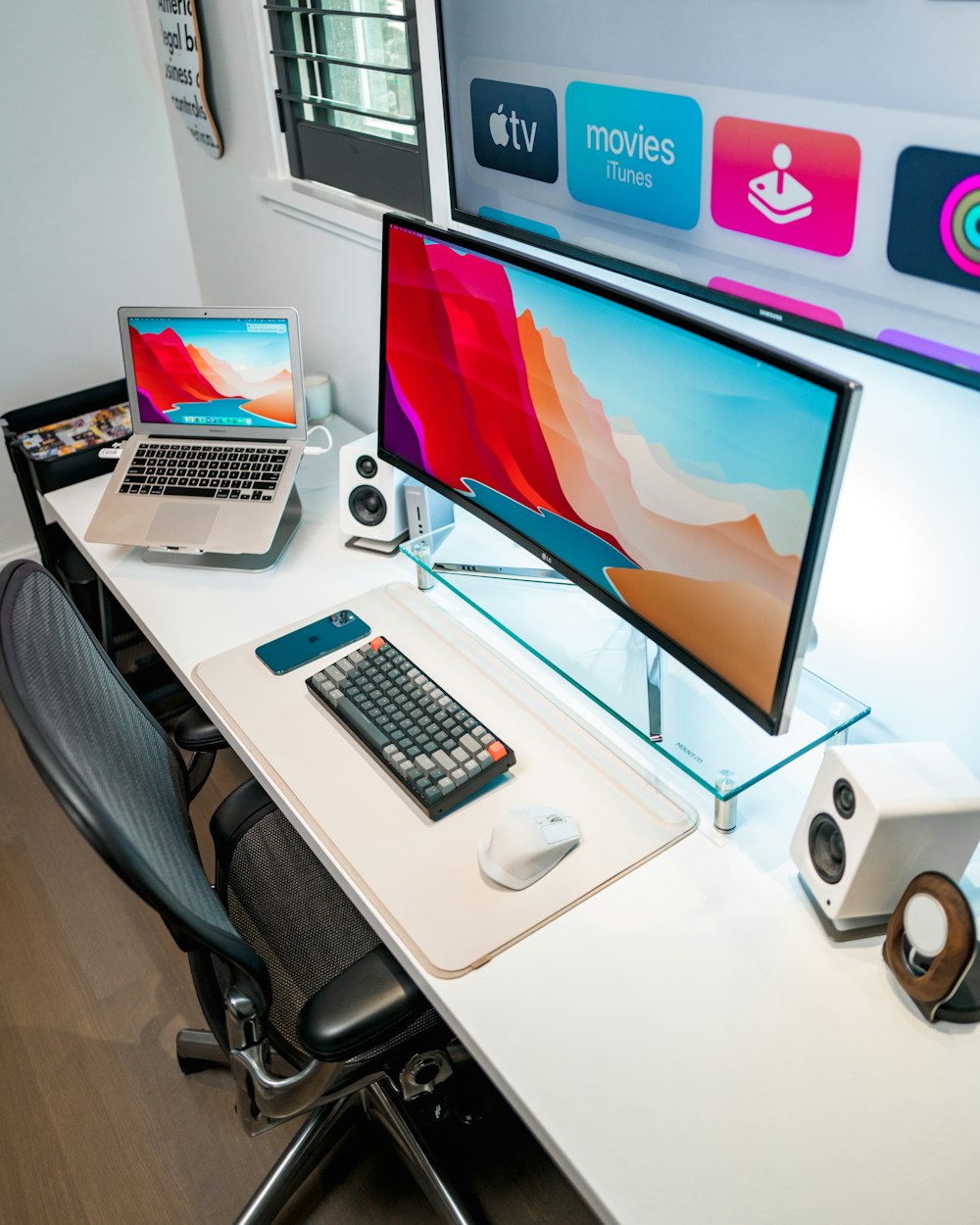 black flat screen computer monitor on white table