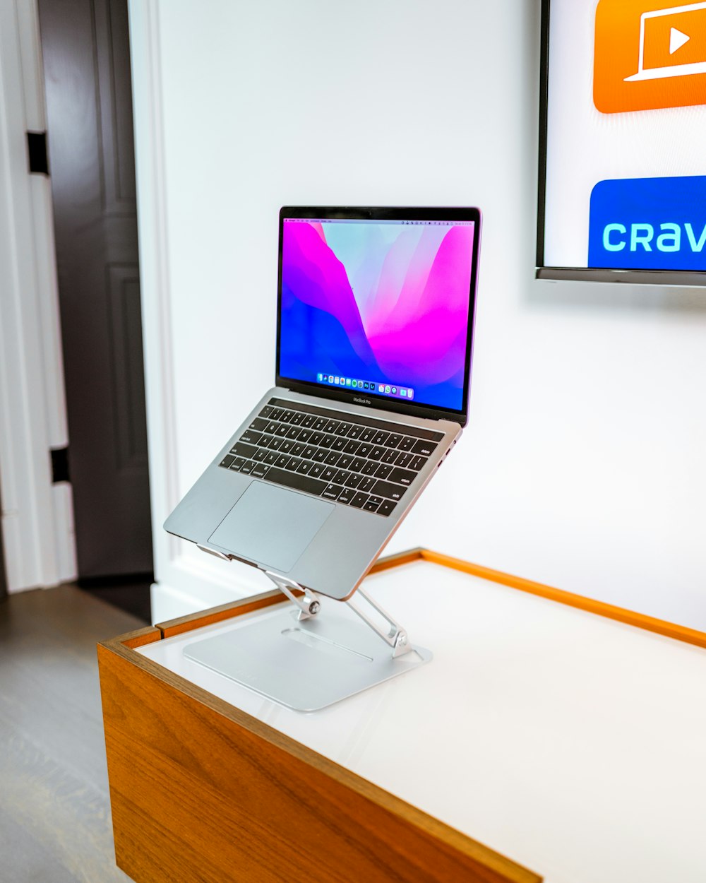 macbook pro on brown wooden table