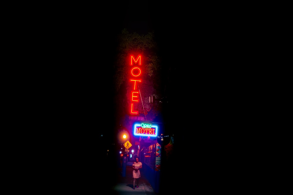 red and blue led light signage during nighttime